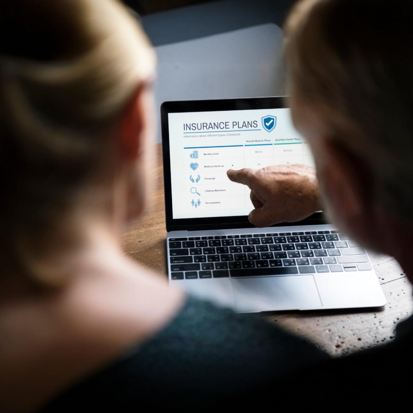 Reviewing health insurance plan options online during enrollment